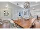 Dining room featuring modern decor, a beautiful light fixture, and an open concept layout at 1071 Owl Dr, Englewood, FL 34223