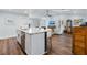 Bright open concept features kitchen island flowing into the living space at 1071 Owl Dr, Englewood, FL 34223