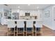 Modern kitchen features a large island with seating and stainless steel appliances at 1071 Owl Dr, Englewood, FL 34223