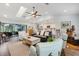 Open-concept living area showcasing kitchen, living and dining spaces, with vaulted ceilings at 1071 Owl Dr, Englewood, FL 34223