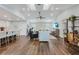 Living room area featuring vaulted ceilings and an open design with bar seating at the kitchen island at 1071 Owl Dr, Englewood, FL 34223