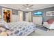 Comfortable main bedroom with white furnishings, a TV and ensuite bathroom and closet at 1071 Owl Dr, Englewood, FL 34223