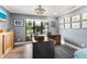 Stylish home office with hardwood floors, large window view, and custom-built desk at 1071 Owl Dr, Englewood, FL 34223
