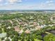 Overhead view of a residential neighborhood with tree-lined streets and several community ponds at 11009 Wildcat Dr, Riverview, FL 33579