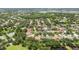 Beautiful aerial view of a residential community with lush green trees and multiple ponds at 11009 Wildcat Dr, Riverview, FL 33579