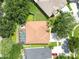 Overhead shot of home with a screened-in pool, manicured yard, and mature trees, offering privacy at 11009 Wildcat Dr, Riverview, FL 33579