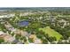 Overhead view of a community with ponds, trees, recreation areas, and single-Gathering homes at 11009 Wildcat Dr, Riverview, FL 33579