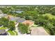 Wide-angle picture highlighting a residential area with tree-lined streets, bodies of water, and homes with well-maintained yards at 11009 Wildcat Dr, Riverview, FL 33579