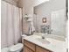 Bathroom featuring a vanity with a sink, a toilet, and a shower with a curtain at 11009 Wildcat Dr, Riverview, FL 33579