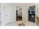 Bathroom with doorways to bedroom and closet and neutral tile flooring at 11009 Wildcat Dr, Riverview, FL 33579