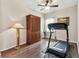 Bright bedroom with a ceiling fan, and hardwood floors perfect for exercise or relaxation at 11009 Wildcat Dr, Riverview, FL 33579