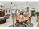 Open floor plan with a dining table and seating, connecting to the living room at 11009 Wildcat Dr, Riverview, FL 33579