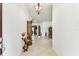 Inviting entryway showcasing neutral tones, tile flooring, and decorative furniture at 11009 Wildcat Dr, Riverview, FL 33579