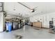 Large garage with various household items, storage solutions, and durable flooring at 11009 Wildcat Dr, Riverview, FL 33579