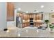 Open kitchen featuring granite countertops, stainless steel appliances, and ample cabinet space at 11009 Wildcat Dr, Riverview, FL 33579