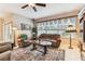 Inviting living room with a plush sofa, armchairs, decorative rug, and large window with a view at 11009 Wildcat Dr, Riverview, FL 33579