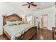 Comfortable bedroom featuring hardwood flooring, ornate furniture, and ample closet space at 11009 Wildcat Dr, Riverview, FL 33579