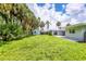 A generous lawn, storage shed, and patio area create a serene outdoor space for relaxation and enjoyment at 116 Myakka Dr, Venice, FL 34293