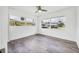 Well-lit bedroom with hardwood floors and large windows offering an abundance of natural light at 116 Myakka Dr, Venice, FL 34293