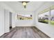 Bright bedroom with lots of natural light offers modern floors and a ceiling fan at 116 Myakka Dr, Venice, FL 34293