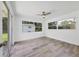 Large bright bedroom with lots of natural light and a sliding glass door to the outdoors at 116 Myakka Dr, Venice, FL 34293