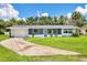 Charming single-story home features a well-maintained lawn and an attached garage at 116 Myakka Dr, Venice, FL 34293