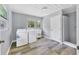 Bright laundry room with washer, dryer, utility sink, and access to shower at 116 Myakka Dr, Venice, FL 34293