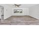 Bright living room featuring sleek flooring, neutral decor, and ample natural light at 116 Myakka Dr, Venice, FL 34293