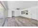 Bright living room featuring sleek flooring, neutral decor, and ample natural light at 116 Myakka Dr, Venice, FL 34293