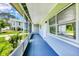 View of the long screened-in porch, offering a comfortable outdoor space at 116 Myakka Dr, Venice, FL 34293