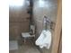 Accessible bathroom featuring a mounted urinal and safety handrails at 1209 Croydonwood Cir, Brandon, FL 33510