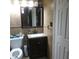 Classic bathroom vanity with granite countertop and tile flooring at 1209 Croydonwood Cir, Brandon, FL 33510