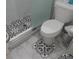 Bathroom features a modern shower with decorative tile and a white toilet at 1209 Croydonwood Cir, Brandon, FL 33510