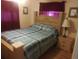 Comfortable bedroom with wooden furniture, including a bed and nightstand at 1209 Croydonwood Cir, Brandon, FL 33510