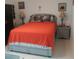Cozy bedroom with nightstands, lamps, and wall art creating a relaxing atmosphere at 1209 Croydonwood Cir, Brandon, FL 33510