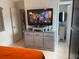 Bedroom with a tv set up on a bureau and a glimpse into a bathroom at 1209 Croydonwood Cir, Brandon, FL 33510