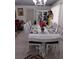 Lovely dining area featuring a white table set with seating for six underneath a chandelier at 1209 Croydonwood Cir, Brandon, FL 33510