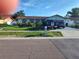 Charming single-story home with a well-manicured lawn and inviting curb appeal with driveway parking at 1209 Croydonwood Cir, Brandon, FL 33510