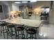 Spacious kitchen features a large island with seating and stainless steel appliances at 1209 Croydonwood Cir, Brandon, FL 33510