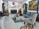 Cozy living room featuring a fireplace, a modern couch and stylish decorations at 1209 Croydonwood Cir, Brandon, FL 33510