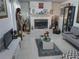 Inviting living room with a cozy fireplace, tile flooring, and modern decor at 1209 Croydonwood Cir, Brandon, FL 33510