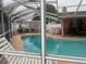 Sparkling screened-in pool surrounded by a spacious deck, perfect for relaxation and entertaining at 1209 Croydonwood Cir, Brandon, FL 33510