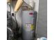 Utility room featuring a modern, gray water heater at 1209 Croydonwood Cir, Brandon, FL 33510