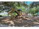 Community playground with slides, climbing structures, and mature trees at 12113 Whistling Way, Lakewood Ranch, FL 34202