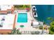 Resort-style pool and spa area with comfortable lounge chairs overlooking the community boat docks at 1257 S Portofino Dr # 306, Sarasota, FL 34242