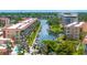 Breathtaking aerial view of the community showcasing waterfront access, lush landscaping, and boat docks at 1257 S Portofino Dr # 306, Sarasota, FL 34242