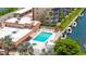 Community pool with ample seating and a spa, offering stunning views of the surrounding canal at 1257 S Portofino Dr # 306, Sarasota, FL 34242
