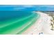 Beautiful beach with white sand, clear turquoise water, and plenty of space for activities at 1257 S Portofino Dr # 306, Sarasota, FL 34242