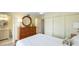 Comfortable bedroom features a Queen bed and an attached bathroom at 1257 S Portofino Dr # 306, Sarasota, FL 34242