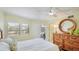 Comfortable bedroom features a Queen bed, wood floors and plenty of dresser space at 1257 S Portofino Dr # 306, Sarasota, FL 34242